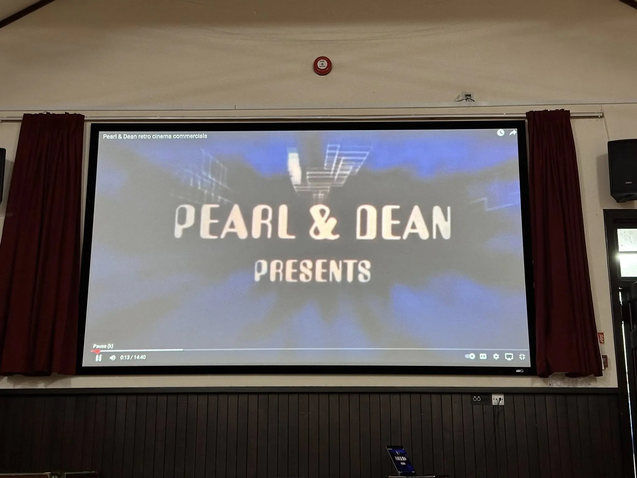 Picture of big screen with pearl and dean advertising